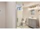 Bathroom featuring a modern glass door shower and gray vanity at 9295 E 12Th Ave, Aurora, CO 80010