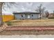 Well-kept single story with a brick facade and tidy front yard, offering a classic, welcoming curb appeal at 9295 E 12Th Ave, Aurora, CO 80010