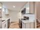 Bright kitchen featuring white cabinetry and stainless steel appliances at 9295 E 12Th Ave, Aurora, CO 80010