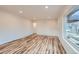 Bright and airy living room featuring beautiful wood floors, fresh paint, and ample natural light at 9295 E 12Th Ave, Aurora, CO 80010