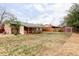 Expansive backyard with mature trees, fence, and shed offers privacy and space at 822 S Worchester St, Aurora, CO 80012
