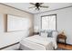 A serene bedroom featuring a ceiling fan and hardwood floors at 822 S Worchester St, Aurora, CO 80012