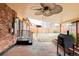 Comfortable covered patio with ceiling fan and grilling area, ideal for outdoor entertaining at 822 S Worchester St, Aurora, CO 80012