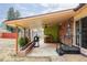 Backyard covered patio with grill area and ceiling fan, perfect for relaxing at 822 S Worchester St, Aurora, CO 80012