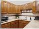 The kitchen features neutral countertops and wood cabinets at 822 S Worchester St, Aurora, CO 80012