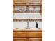A detailed view of a kitchen sink with a tiled backsplash at 822 S Worchester St, Aurora, CO 80012
