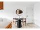 Charming dining nook in the kitchen with a stylish black table and seating for two at 822 S Worchester St, Aurora, CO 80012