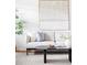 Close up of the sofa and coffee table showcasing the elegant design of the living room at 822 S Worchester St, Aurora, CO 80012