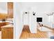 The view into the living room offers hardwood floors and lots of light at 822 S Worchester St, Aurora, CO 80012