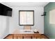 Home office boasts a well-lit desk space and modern decor for productivity at 822 S Worchester St, Aurora, CO 80012