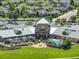 Aerial view of a clubhouse featuring an outdoor pool, seating, and lush landscaping, set in a lovely community at 14879 Xenia St, Thornton, CO 80602