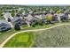 Scenic aerial view of homes near a golf course walking path in a desirable neighborhood at 14879 Xenia St, Thornton, CO 80602