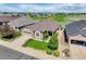Aerial view of a home with a lush green lawn and mature landscaping adjacent to a golf course at 14879 Xenia St, Thornton, CO 80602