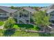 Charming backyard featuring a deck, lush lawn, and stone-wall landscaping, creating a serene outdoor space at 14879 Xenia St, Thornton, CO 80602