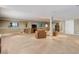 Large basement space featuring neutral carpeting, several windows, and a convenient entertainment area at 14879 Xenia St, Thornton, CO 80602