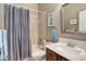 This bathroom features a shower/tub combo with patterned shower curtain at 14879 Xenia St, Thornton, CO 80602