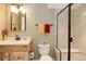 Bathroom featuring a glass-enclosed shower with seating, updated vanity, and decorative elements at 14879 Xenia St, Thornton, CO 80602