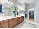 This bathroom features a large vanity with dual sinks and a walk-in closet at 14879 Xenia St, Thornton, CO 80602