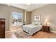 This bedroom features a large window letting in plenty of natural light at 14879 Xenia St, Thornton, CO 80602