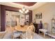 This dining room features tray ceiling, chandelier, and access to other living areas at 14879 Xenia St, Thornton, CO 80602