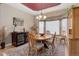 This dining room features a large window, decorative lighting and a wine cooler at 14879 Xenia St, Thornton, CO 80602