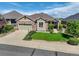 Well-maintained single-Gathering home with an attached garage, manicured lawn, and inviting curb appeal at 14879 Xenia St, Thornton, CO 80602