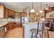 Updated kitchen boasts granite counters, stainless appliances, and a breakfast bar at 14879 Xenia St, Thornton, CO 80602