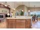 Kitchen with breakfast bar opens to living room with a view at 14879 Xenia St, Thornton, CO 80602