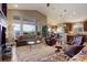 Bright living room with vaulted ceilings, hardwood floors, and a picturesque view of the outdoors at 14879 Xenia St, Thornton, CO 80602