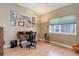 Well-lit office with a large window and hardwood floors at 14879 Xenia St, Thornton, CO 80602