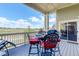 Inviting covered patio features dining and a grill with beautiful views of the open space and blue skies at 14879 Xenia St, Thornton, CO 80602