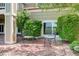 Secluded outdoor patio area has seating surrounded by mature landscaping and provides a relaxing retreat at 14879 Xenia St, Thornton, CO 80602
