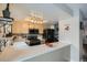 Modern kitchen features stainless steel appliances and breakfast bar at 5260 Garrison St # 6, Arvada, CO 80002