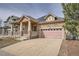 Beautiful home with a two car garage, complemented by stone and siding details at 1260 S Duquesne Cir, Aurora, CO 80018