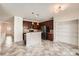Modern kitchen featuring a kitchen island, dark wood cabinetry, and stainless steel appliances at 1260 S Duquesne Cir, Aurora, CO 80018
