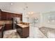 Modern kitchen with stainless steel appliances and granite countertops; great for entertaining at 1260 S Duquesne Cir, Aurora, CO 80018