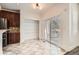 Bright kitchen with a sliding door to a balcony and a walk-in pantry with wire shelves at 1260 S Duquesne Cir, Aurora, CO 80018