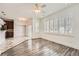 Bright living area featuring large windows and hardwood floors, lots of natural light at 1260 S Duquesne Cir, Aurora, CO 80018