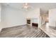 Spacious living room with hardwood floors and a cozy fireplace. Modern ceiling fan installed at 1260 S Duquesne Cir, Aurora, CO 80018