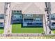 Aerial view showcasing a home with a well-maintained lawn, patio, and beautiful architectural design at 17121 Desert Wine Ln, Parker, CO 80134