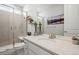 Bright bathroom with a glass shower, white cabinets, and modern fixtures at 17121 Desert Wine Ln, Parker, CO 80134
