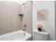 Cozy bathroom featuring tiled tub, a rain shower head, and stylish decor at 17121 Desert Wine Ln, Parker, CO 80134