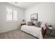 Serene bedroom with natural light, a daybed, and minimalist decor, creating a cozy space at 17121 Desert Wine Ln, Parker, CO 80134