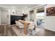 Inviting dining area featuring a modern wood table, stylish chairs, and natural light from sliding glass doors at 17121 Desert Wine Ln, Parker, CO 80134