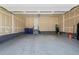 Spacious garage with epoxy flooring, overhead door, and access door to the house for easy storage and convenience at 17121 Desert Wine Ln, Parker, CO 80134