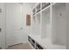 Organized mudroom with built-in cubbies, bench seating, and ample storage at 17121 Desert Wine Ln, Parker, CO 80134