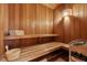 An indoor wooden sauna with benches and bucket at 29590 Buchanan Dr, Evergreen, CO 80439