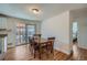 Cozy dining room featuring hardwood floors and a sliding door leading to outdoor patio at 3148 Victor St, Aurora, CO 80011