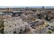 An aerial view shows the apartment building and surrounding streets, showcasing parking and nearby buildings at 375 Josephine St # D, Denver, CO 80206