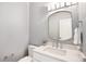 Stylish powder room with a modern vanity, mirror, and lighting fixtures at 375 Josephine St # D, Denver, CO 80206